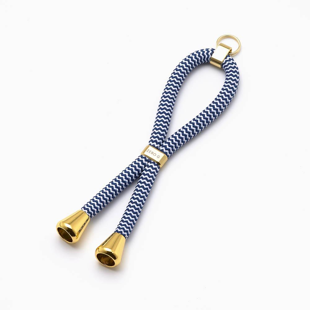 dunkelblau weiss gestreifter Schlüsselanhänger mit goldenem Slider und Endstücken.
