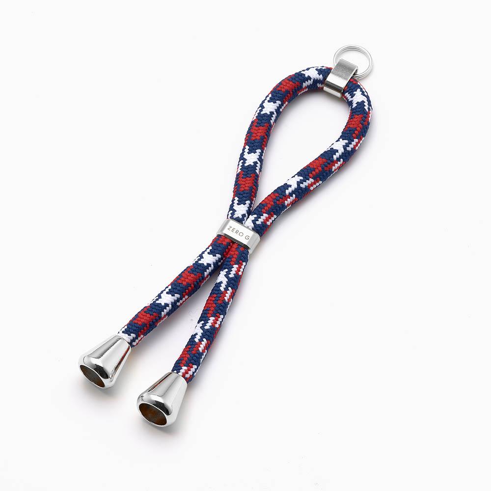 rot blau weiss gemusterter Schlüsselanhänger mit silbernem Slider und Endstücken.