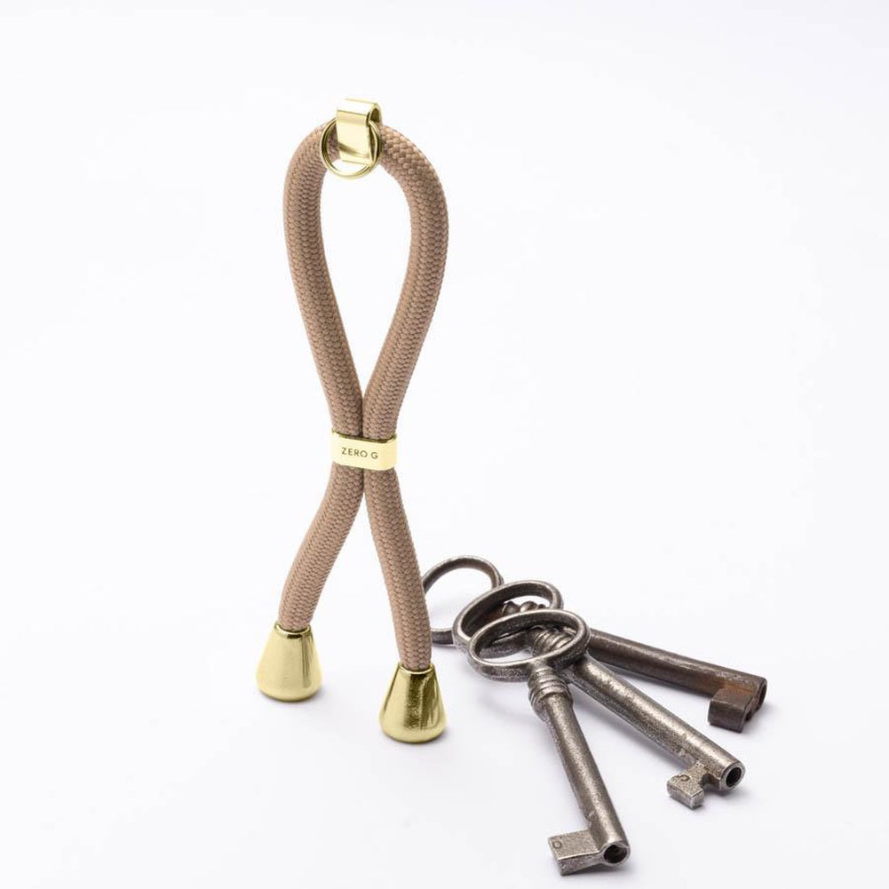 Beiger Schlüsselanhänger mit goldenem Slider und Endstücken
